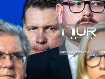 Przemyslaw Czarnek (C) member of the Law and Justice party,  during a press conference on party finances in Warsaw, Poland, on November 19,...