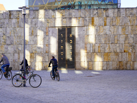 This image captures a moment at the Ohel Jakob Synagogue on St. Jakob's Square in Munich, Germany, on January 7, 2023. The warm limestone ti...