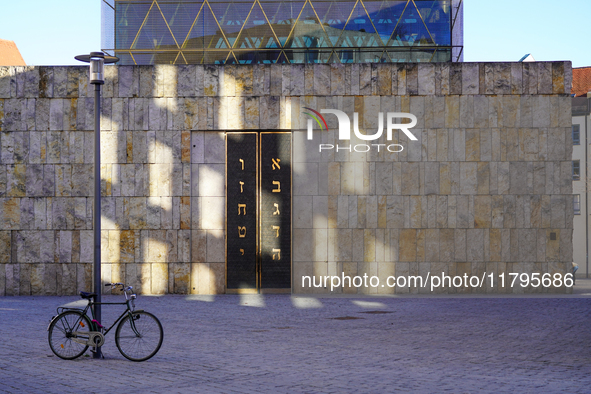 A bicycle parks near the entrance of the Ohel Jakob synagogue on St. Jakob's Square in Munich, Germany, on January 7, 2023. The sunlight cre...