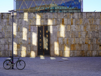 A bicycle parks near the entrance of the Ohel Jakob synagogue on St. Jakob's Square in Munich, Germany, on January 7, 2023. The sunlight cre...