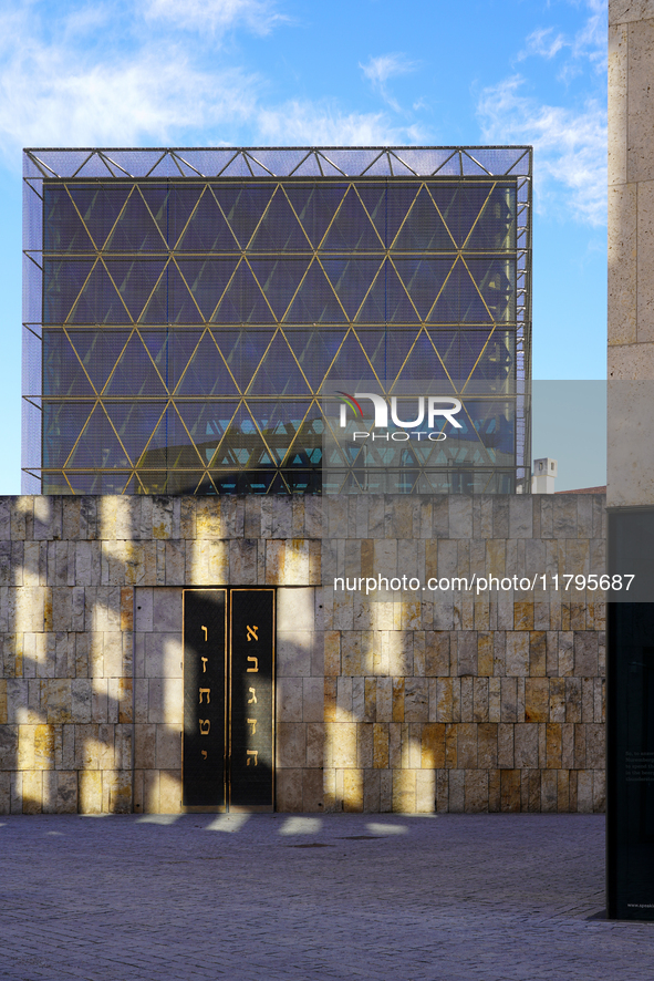 This image shows the outer portal wall of the Ohel Jakob Synagogue on St. Jakob's Square in Munich, Germany, on January 7, 2023. The golden...