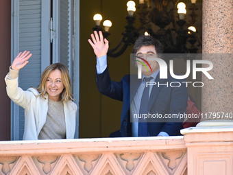 Italian Prime Minister Giorgia Meloni and Argentinian President Javier Milei greet from the balcony of the Argentine Government House in Bue...