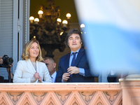 Italian Prime Minister Giorgia Meloni and Argentinian President Javier Milei greet from the balcony of the Argentine Government House in Bue...