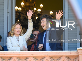 Italian Prime Minister Giorgia Meloni and Argentinian President Javier Milei greet from the balcony of the Argentine Government House in Bue...