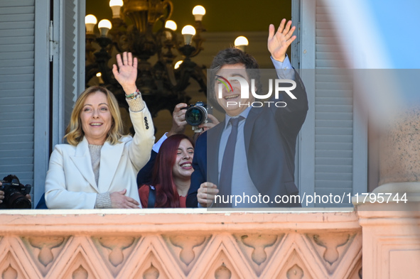 Italian Prime Minister Giorgia Meloni and Argentinian President Javier Milei greet from the balcony of the Argentine Government House in Bue...