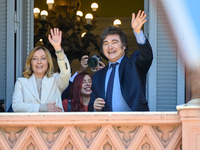 Italian Prime Minister Giorgia Meloni and Argentinian President Javier Milei greet from the balcony of the Argentine Government House in Bue...