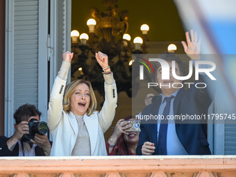 Italian Prime Minister Giorgia Meloni and Argentinian President Javier Milei greet from the balcony of the Argentine Government House in Bue...