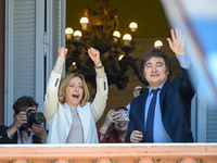 Italian Prime Minister Giorgia Meloni and Argentinian President Javier Milei greet from the balcony of the Argentine Government House in Bue...