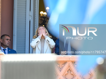 Italian Prime Minister Giorgia Meloni and Argentinian President Javier Milei greet from the balcony of the Argentine Government House in Bue...