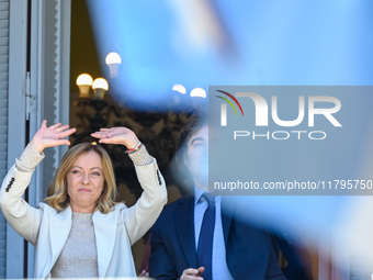 Italian Prime Minister Giorgia Meloni and Argentinian President Javier Milei greet from the balcony of the Argentine Government House in Bue...