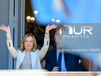 Italian Prime Minister Giorgia Meloni and Argentinian President Javier Milei greet from the balcony of the Argentine Government House in Bue...