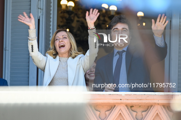 Italian Prime Minister Giorgia Meloni and Argentinian President Javier Milei greet from the balcony of the Argentine Government House in Bue...