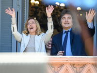 Italian Prime Minister Giorgia Meloni and Argentinian President Javier Milei greet from the balcony of the Argentine Government House in Bue...