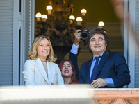 Italian Prime Minister Giorgia Meloni and Argentinian President Javier Milei greet from the balcony of the Argentine Government House in Bue...