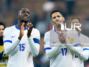 Ibrahima Konate' of France and William Saliba greet the fans at the end of the UEFA Nations League 2024/25 League A Group 2 match between It...