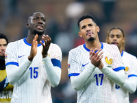 Ibrahima Konate' of France and William Saliba greet the fans at the end of the UEFA Nations League 2024/25 League A Group 2 match between It...