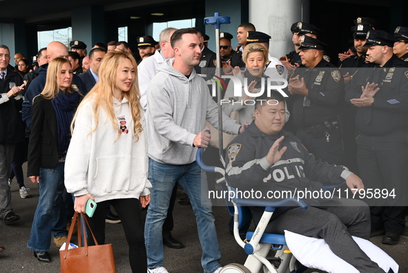 36-year-old, 7-year veteran New York City Police Department Officer Rich Wong is released from Jamaica Hospital after being shot in Jamaica,...