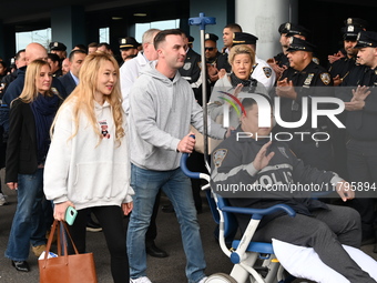 36-year-old, 7-year veteran New York City Police Department Officer Rich Wong is released from Jamaica Hospital after being shot in Jamaica,...