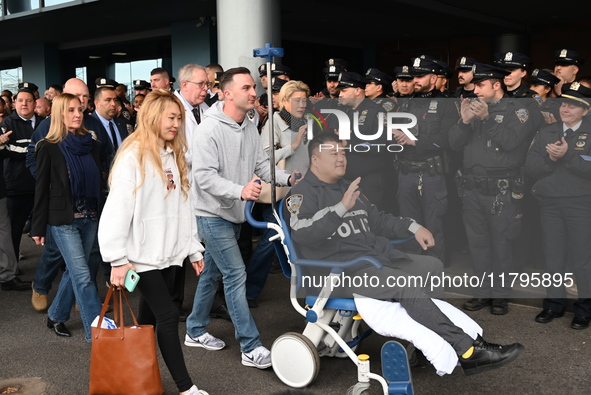 36-year-old, 7-year veteran New York City Police Department Officer Rich Wong is released from Jamaica Hospital after being shot in Jamaica,...