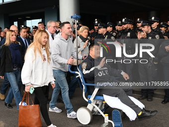 36-year-old, 7-year veteran New York City Police Department Officer Rich Wong is released from Jamaica Hospital after being shot in Jamaica,...