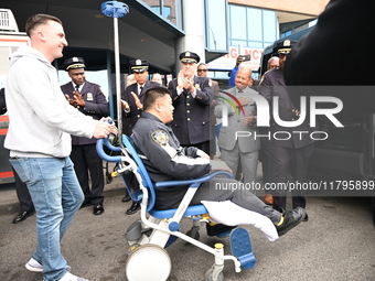 36-year-old, 7-year veteran New York City Police Department Officer Rich Wong is released from Jamaica Hospital after being shot in Jamaica,...