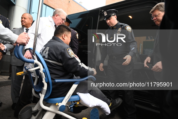 36-year-old, 7-year veteran New York City Police Department Officer Rich Wong is released from Jamaica Hospital after being shot in Jamaica,...