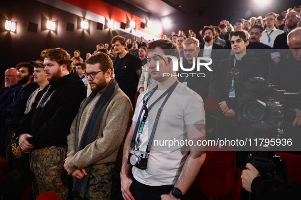 The audience stands in a minute of silence before the world premiere of  'Rust' film during the 32nd International Film Festival Energa CAME...