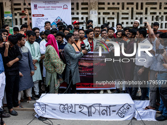 A few people organize a coffin procession at Dhaka University demanding a ban on the Bangladesh Awami League and their associated parties, i...