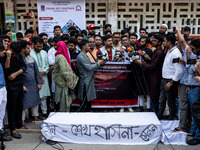 A few people organize a coffin procession at Dhaka University demanding a ban on the Bangladesh Awami League and their associated parties, i...