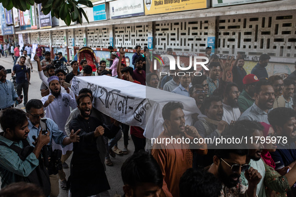 A few people organize a coffin procession at Dhaka University demanding a ban on the Bangladesh Awami League and their associated parties, i...