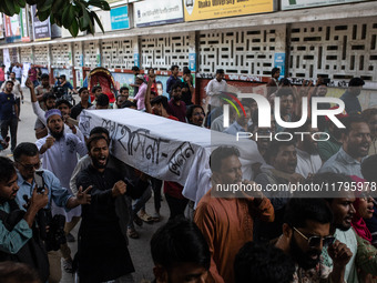 A few people organize a coffin procession at Dhaka University demanding a ban on the Bangladesh Awami League and their associated parties, i...