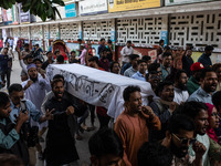 A few people organize a coffin procession at Dhaka University demanding a ban on the Bangladesh Awami League and their associated parties, i...