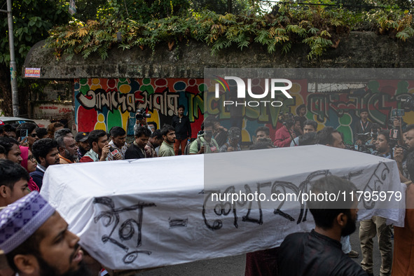 A few people organize a coffin procession at Dhaka University demanding a ban on the Bangladesh Awami League and their associated parties, i...