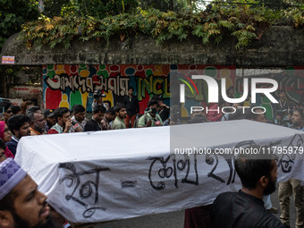 A few people organize a coffin procession at Dhaka University demanding a ban on the Bangladesh Awami League and their associated parties, i...