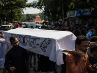 A few people organize a coffin procession at Dhaka University demanding a ban on the Bangladesh Awami League and their associated parties, i...