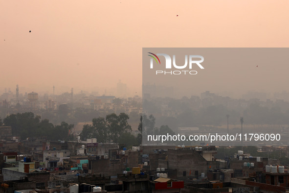 Fog engulfs the city skyline in Jaipur, Rajasthan, India, on November 20, 2024. 