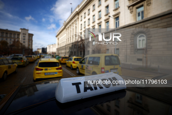 Bulgarian taxi drivers block Tsar Osvoboditel Boulevard with their cars to protest against plans for higher transport insurance tariffs in S...