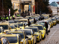 Bulgarian taxi drivers block Tsar Osvoboditel Boulevard with their cars to protest against plans for higher transport insurance tariffs in S...