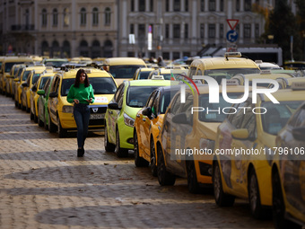 Bulgarian taxi drivers block Tsar Osvoboditel Boulevard with their cars to protest against plans for higher transport insurance tariffs in S...