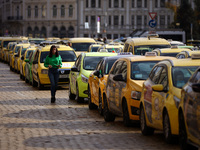 Bulgarian taxi drivers block Tsar Osvoboditel Boulevard with their cars to protest against plans for higher transport insurance tariffs in S...