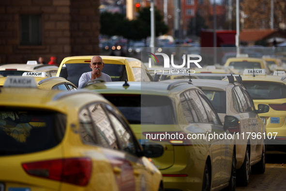 Bulgarian taxi drivers block Tsar Osvoboditel Boulevard with their cars to protest against plans for higher transport insurance tariffs in S...