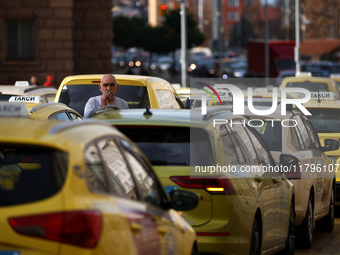 Bulgarian taxi drivers block Tsar Osvoboditel Boulevard with their cars to protest against plans for higher transport insurance tariffs in S...