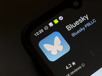 The logo of the social network Bluesky appears on the screen of a smartphone in Reno, United States, on November 20, 2024. (