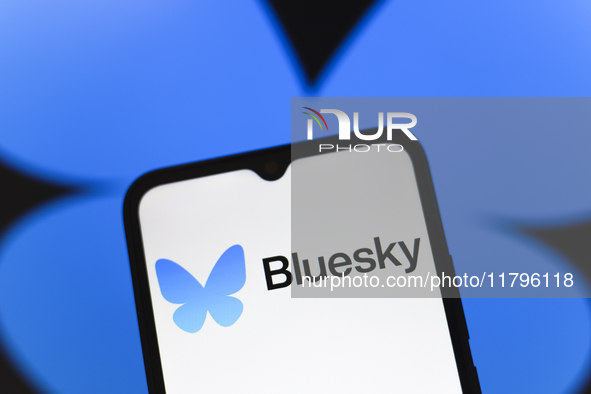 The logo of the social network Bluesky appears on the screen of a smartphone in Reno, United States, on November 20, 2024. 