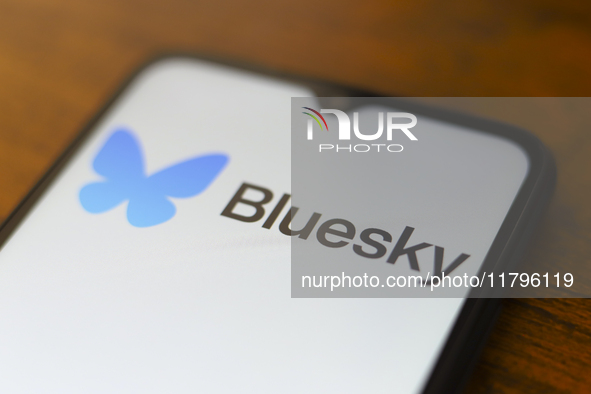 The logo of the social network Bluesky appears on the screen of a smartphone in Reno, United States, on November 20, 2024. 