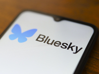 The logo of the social network Bluesky appears on the screen of a smartphone in Reno, United States, on November 20, 2024. (