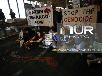 People demonstrate outside the U.S. Consulate in Tel Aviv, Israel, on November 20, 2024, ahead of a vote by the U.S. Senate on legislation t...