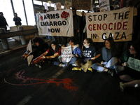 People demonstrate outside the U.S. Consulate in Tel Aviv, Israel, on November 20, 2024, ahead of a vote by the U.S. Senate on legislation t...