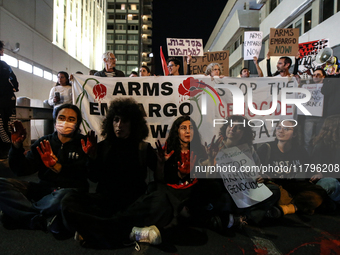 People demonstrate outside the U.S. Consulate in Tel Aviv, Israel, on November 20, 2024, ahead of a vote by the U.S. Senate on legislation t...