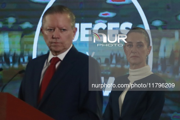 Mexico's President Claudia Sheinbaum Pardo is seen in the background while Arturo Zaldivar Lelo de Larrea, Coordinator of Policy and Governm...